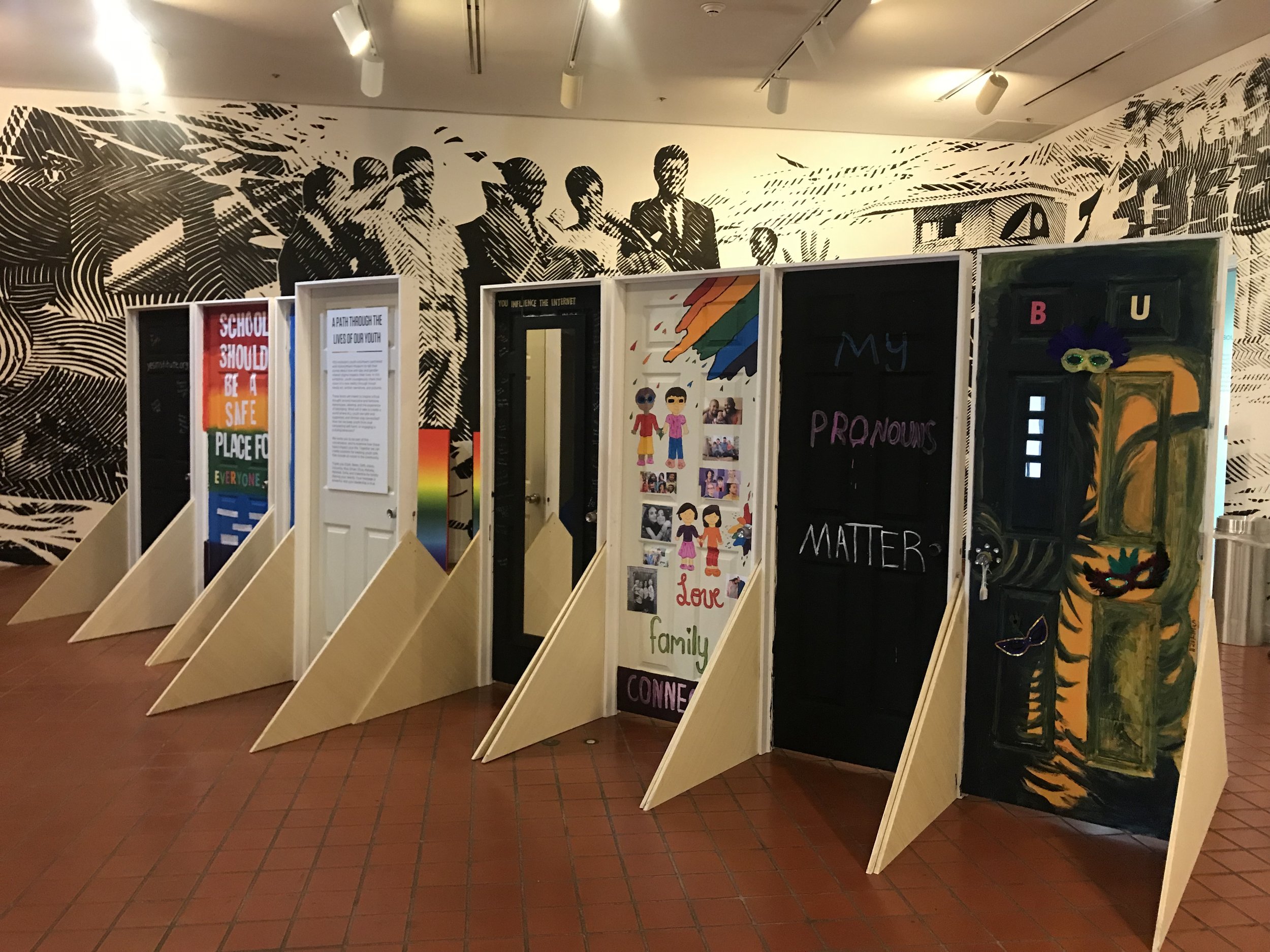 The final doors created by youth for the Queer Miami exhibition. (Photo: HistoryMiami Museum)